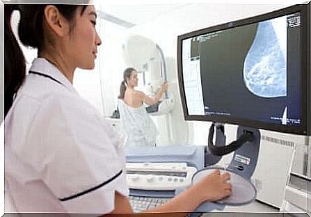 A woman doing a mammogram.
